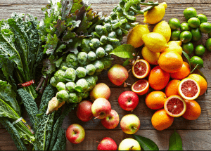 a group of fruits and vegetables on a wood surface Healthy Weight Loss Diets Billericay