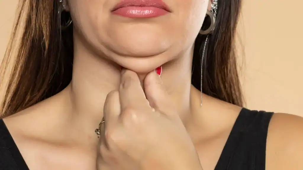 An image of a woman with double chin, sad, worried : Non Surgical Double Chin Removal Treatment in Billericay, UK